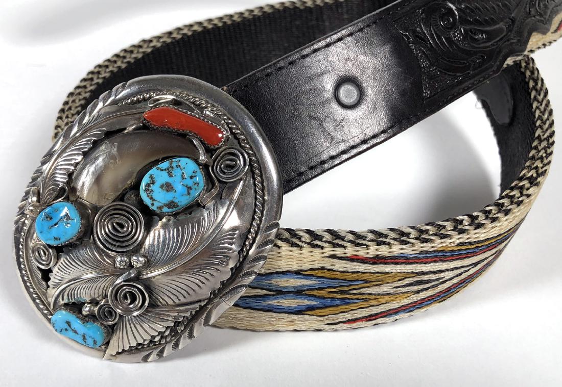 Navajo Sterling Silver Buckle & Woven Belt: Mike Thomas Jr. Navajo sterling silver belt buckle with turquoise and coral stones fitted on a black hand tooled Grants Leather belt with woven Native American geometric design. Buckle signed M. Thoma