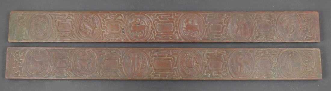 Tiffany Studios Zodiac Bronze Blotter Ends: Part of a Tiffany Zodiac pattern desk set being offered in today's auction. Bronze blotter borders. Each measures about 19-3/8" long. Fine condition.