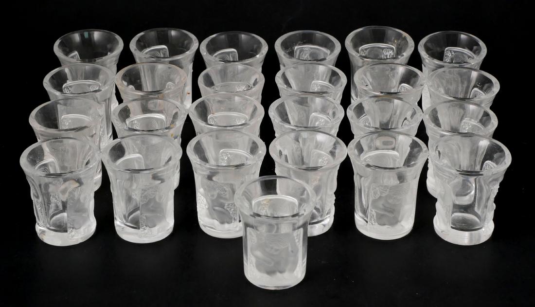 Set of 25 Lalique Enfants Shot Glasses: Set of 25 Lalique liquor shot cups. Each measures about 1-3/4" high. No damage.