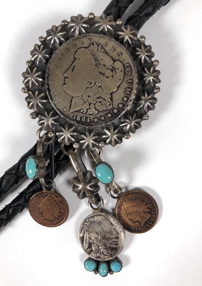 Native American Bolo Tie Set w/ Antique Coins: Vintage Native American bolo tie set with Morgan Silver Dollar, two Indian Head Pennies and a Buffalo Nickel, with turquoise cabochon accents. Strung on woven black leather cord. Good condition. Main