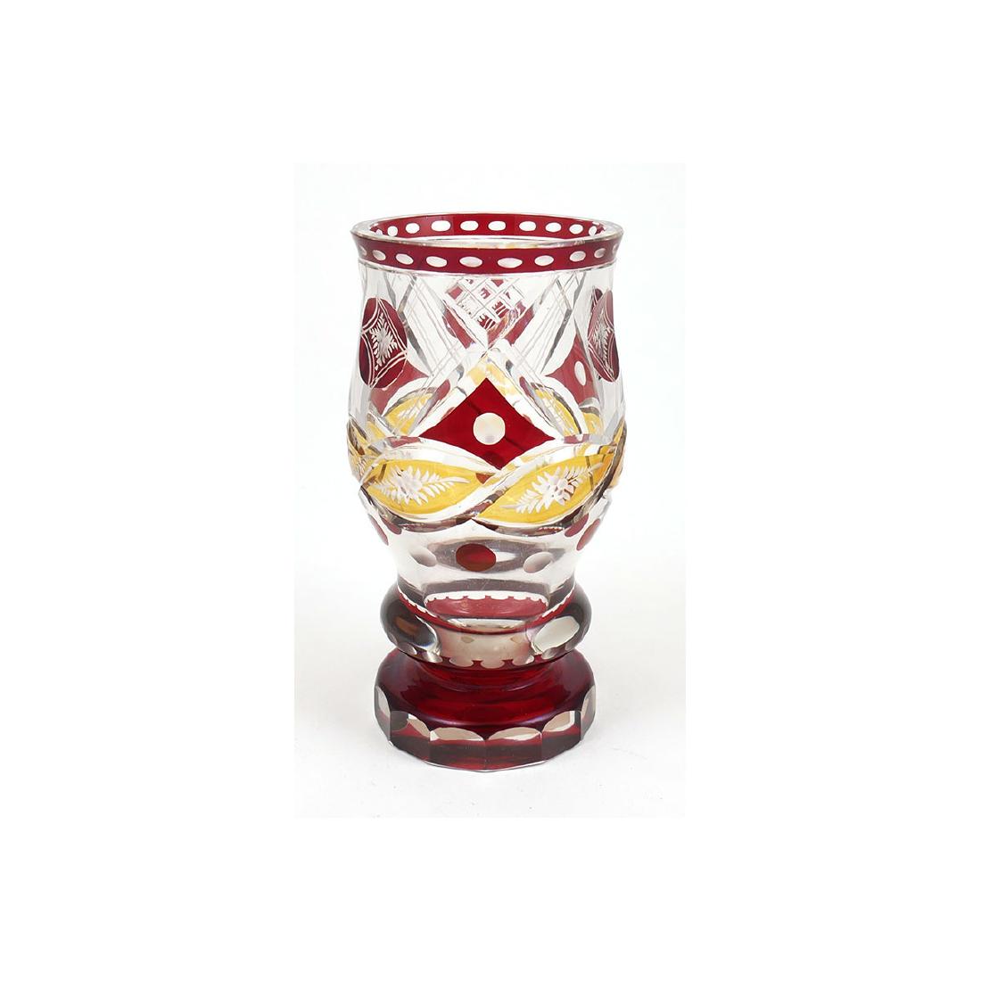 Antique Bohemian Ruby & Gold Cut Glass Vase: Cut to clear vase with geometric designs in red and gold, goblet shape. Unmarked. Good condition, no chips, cracks or scratches. Measures approx. 6-1/4" tall, 3" in diameter.