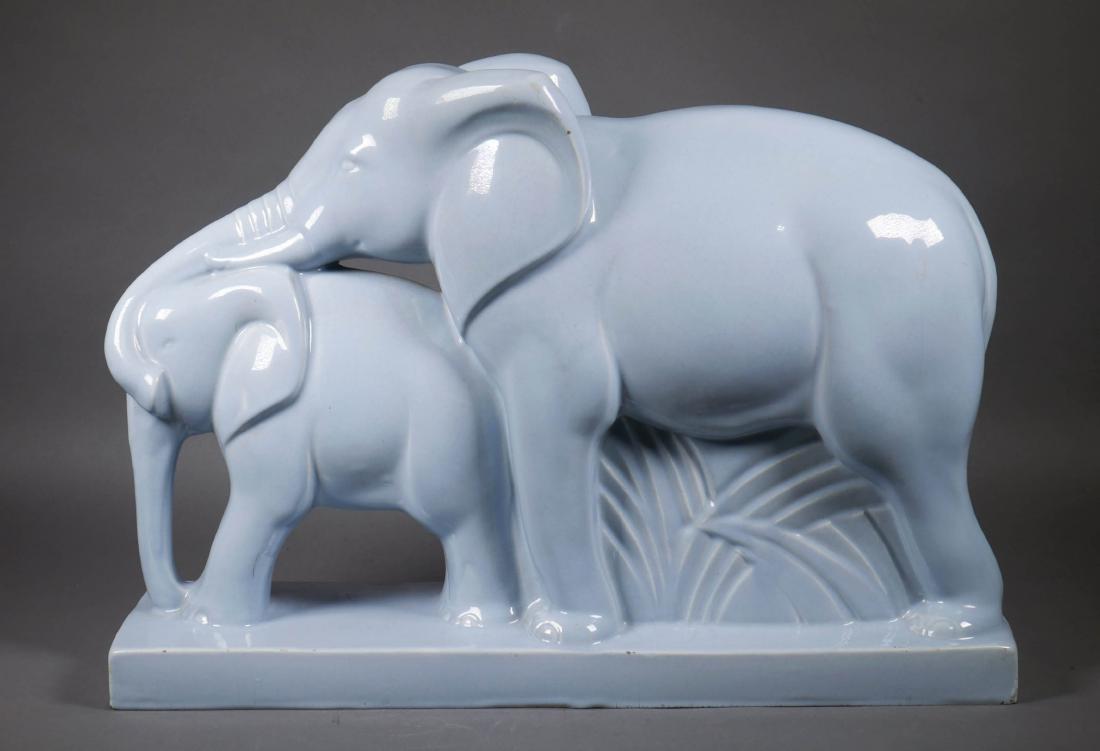 Lemanceau French Art Deco Elephants Statue: French Art Deco porcelain figural group depicting mother and baby elephants glazed in light blue by artist Charles Lemanceau (French, 1905-1980). Signed on reverse at corner of base. Measures approx.