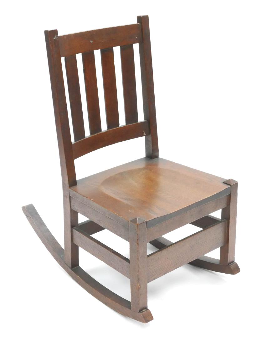 Mission Oak Arts & Crafts Rocking Chair: Arts & Crafts style rocking chair curved crest and lower rail with four vertical back slats, square seat and legs with box stretcher. Original hardware and fasteners. Measures 34" high overall, 14-1/4
