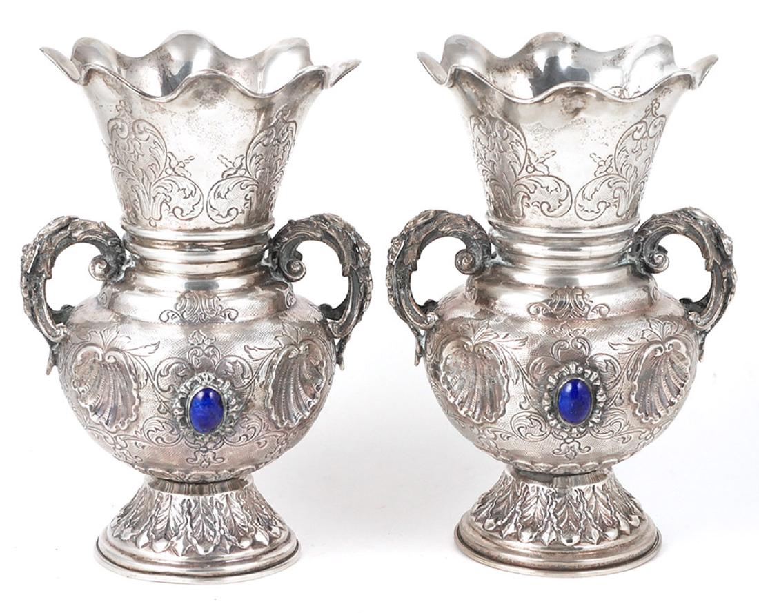 Pair Turkish .900 Coin Silver Repousse Vases: Ornate pair of antique Turkish coin silver vases, repousse shell design on either side of mounted lapis cabochon. Hand-chased. Acanthus base. Each measures about 7-1/2" high. Total silver weight about