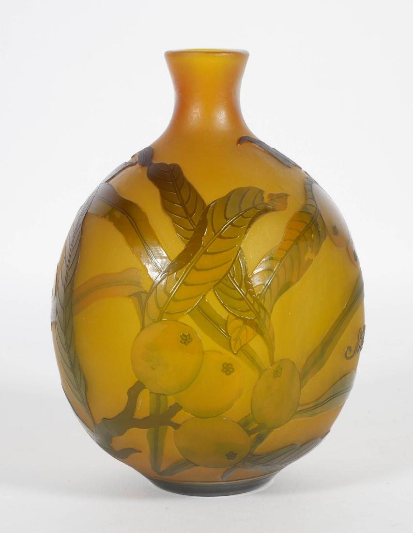 Galle Style French Cameo Vase w/ Citrus: French cameo glass vase with ovoid body and short flared neck. Citrus fruit motif with broad green leaves. Signed "Galle." Measures 7.5" tall.