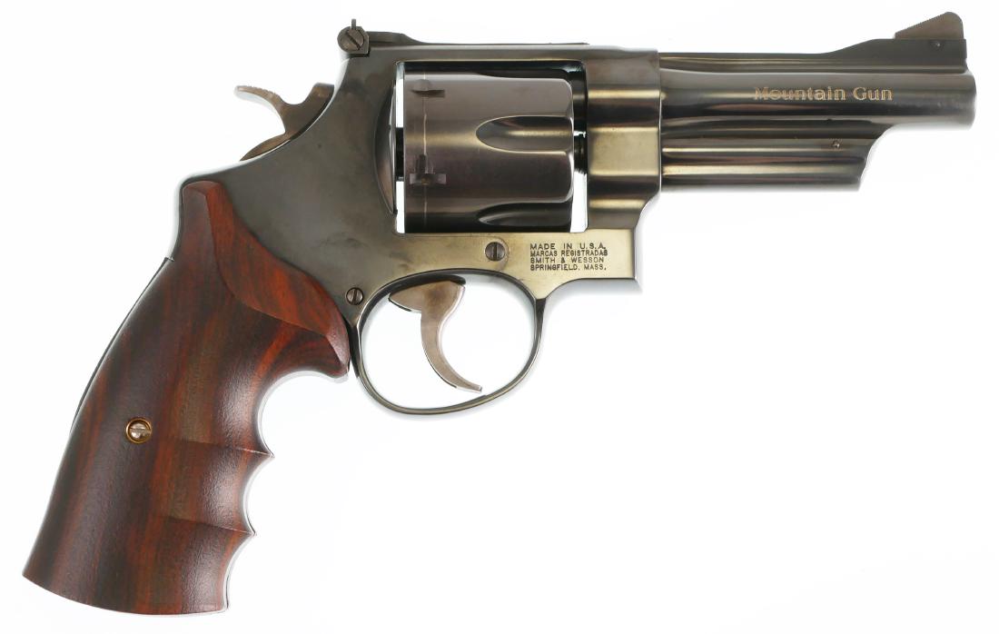 Firearm: Smith & Wesson Model 25 Mountain Gun: Double action S&W revolver in 45 Long Colt. Some light finish wear. Overall very good condition. Original box.