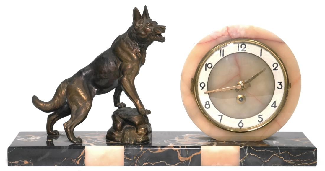 Vintage Art Deco Clock w/ German Shepherd Dog: Vintage French mantel clock in a red, tan and white marble/onyx housing, featuring a hollow metal Art Deco stylized shepherd dog statue. Measures 10" x 19".