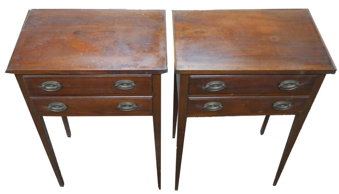 Pair of Federal Style Mahogany End Tables: Mahogany two-drawer end tables with tapered legs and oval brass drawer pulls. Circa 19th Century. Each measures 19" x 21" x 12 1/2".
