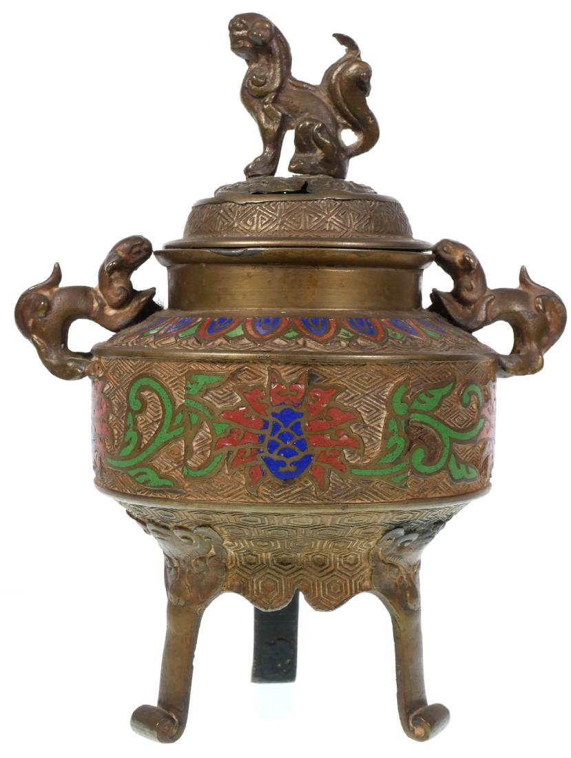 Japanese Bronze Cloisonne Censer: Three footed bronze cloisonne censer decorated in blue, red and green enamels. Appears to have dragon or Hainu form handles as well as another matching creature on the lid. Measures 8 3/4" tall.