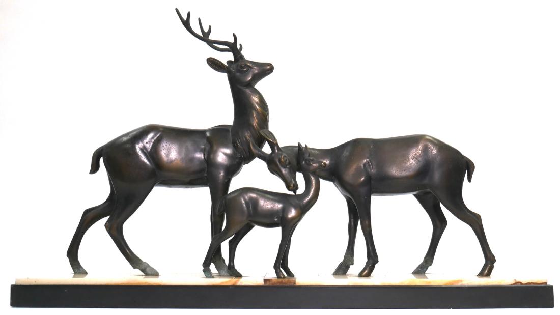 French Art Deco Buck, Doe & Fawn Statue: Art Deco stylized hollow metal statue of a family of deer on multi colored marble base. Measures 28" x 16" x 5-1/2".