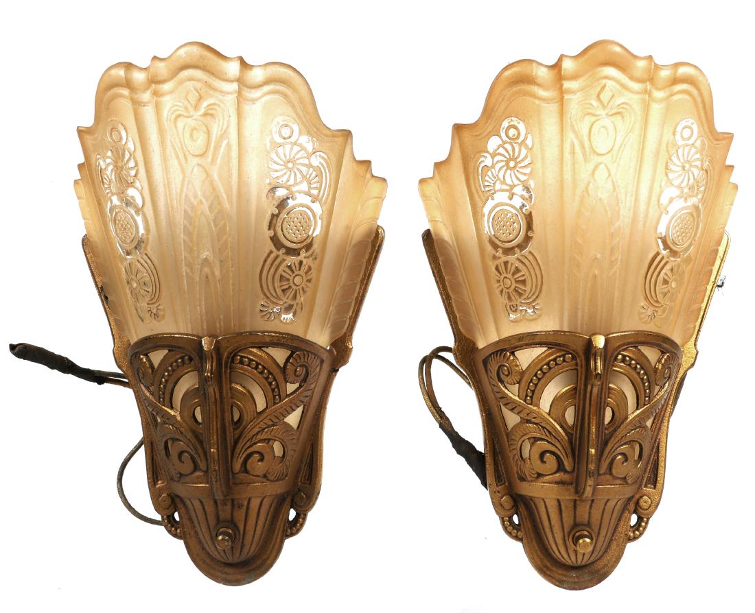 Pair Lightolier Art Deco Glass Gilt Wall Sconces: Slip glass shade, partly frosted yellow on openwork gilt metal sconces. Remnants of Lightolier decals on both sconces. 11" high with shades inserted.