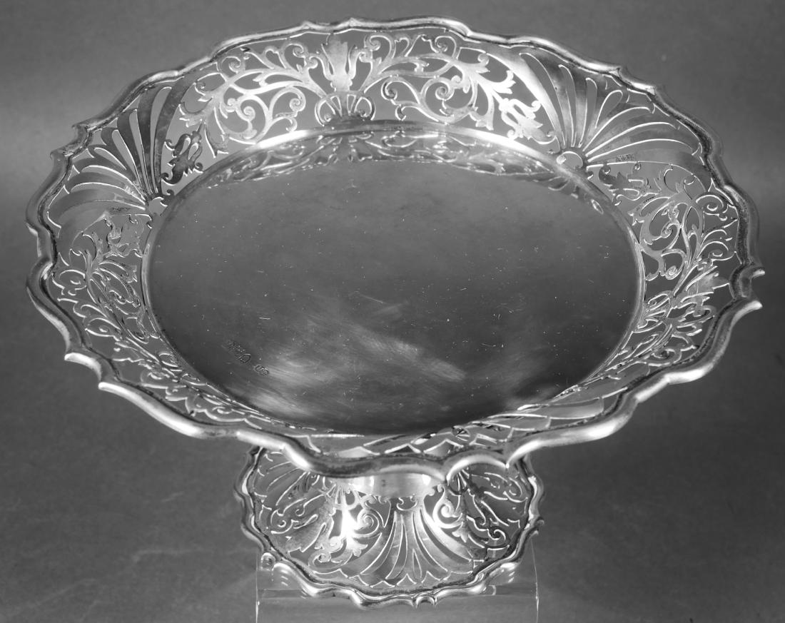 1899 English Sterling Silver Openwork Tazza: Elegant antique Victorian era British sterling silver tazza or footed centerpiece. Bears London mark and "JH" maker's mark. Top measures about 9-1/2" diameter. Weighs 19.5 Troy ounces. (Not weighted o