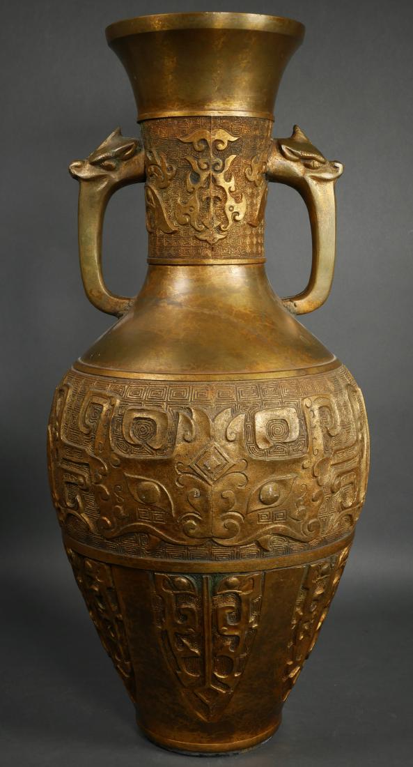 Old 25" Chinese Archaistic Bronze Vase: Large bronze vase with dragon form handles and archaistic Chinese markings. Measures 25" tall.