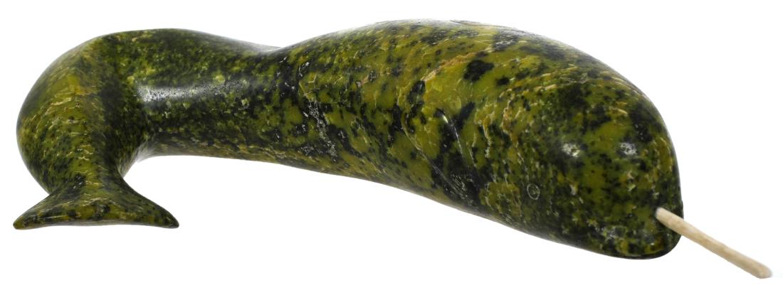 Inuit Narwhal Carving, Green Soapstone: Inuit style soapstone carving of a narwhal. Mottled green with bone tusk. Measures 10" at the longest point.