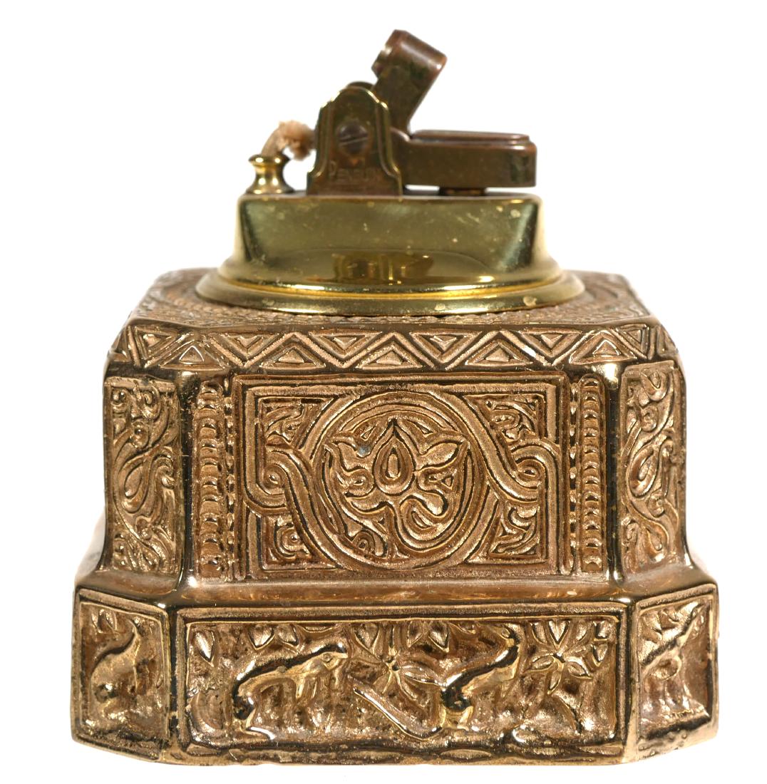 TIFFANY VENETIAN Gilt Bronze Cigarette Lighter: Bronze Tiffany desk set cigarette lighter (possibly a modified inkwell) in the "Venetian" pattern. Invicta coated. Measures 3" x 3" x 2" tall. Circa 1920s. Tiffany Studios, New York mark under base. M