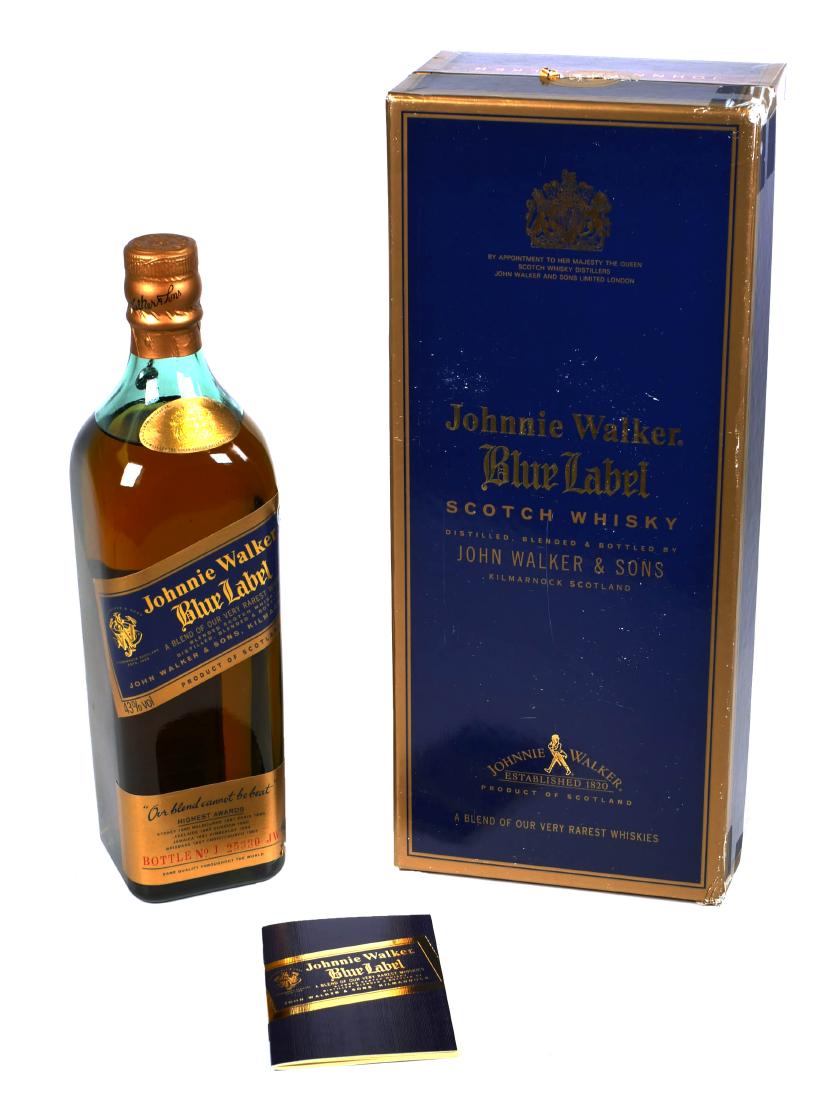Vintage Johnnie Walker Blue Sealed Bottle: Unopened and stamp-sealed vintage bottle of Johnnie Walker Blue Label Scotch whiskey. 750 ml Volume.