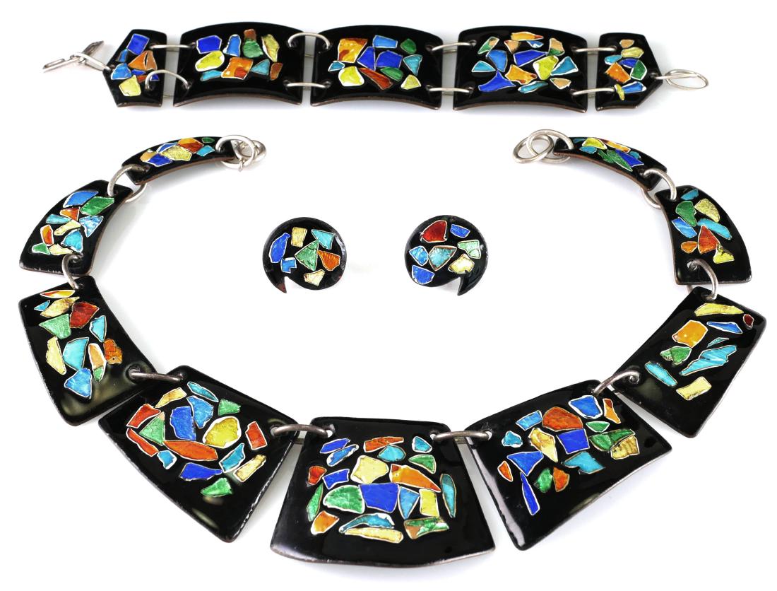 Vintage Modernist Enamel Jewelry Set: Vintage enamel copper jewelry set, including a necklace, a bracelet and earrings. Signed with what appears to be "Corenne." Black enamel ground with inlaid foil back colored chips, similar to Japanese