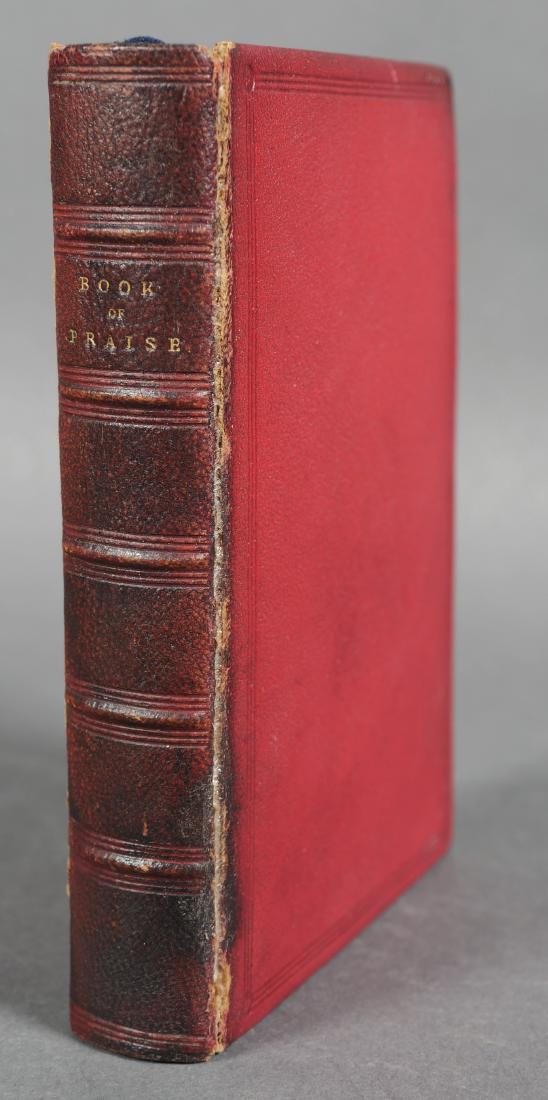 Book: 1862, Book of Praise, Foredge Painting: Book of Praise from the Best English Hymn Writers, Roundel Palmer, editor, published Macmillan and Co. in London, 1862. Red leather with raised bands. Measures 6" tall. Gilt page block with foredge pa
