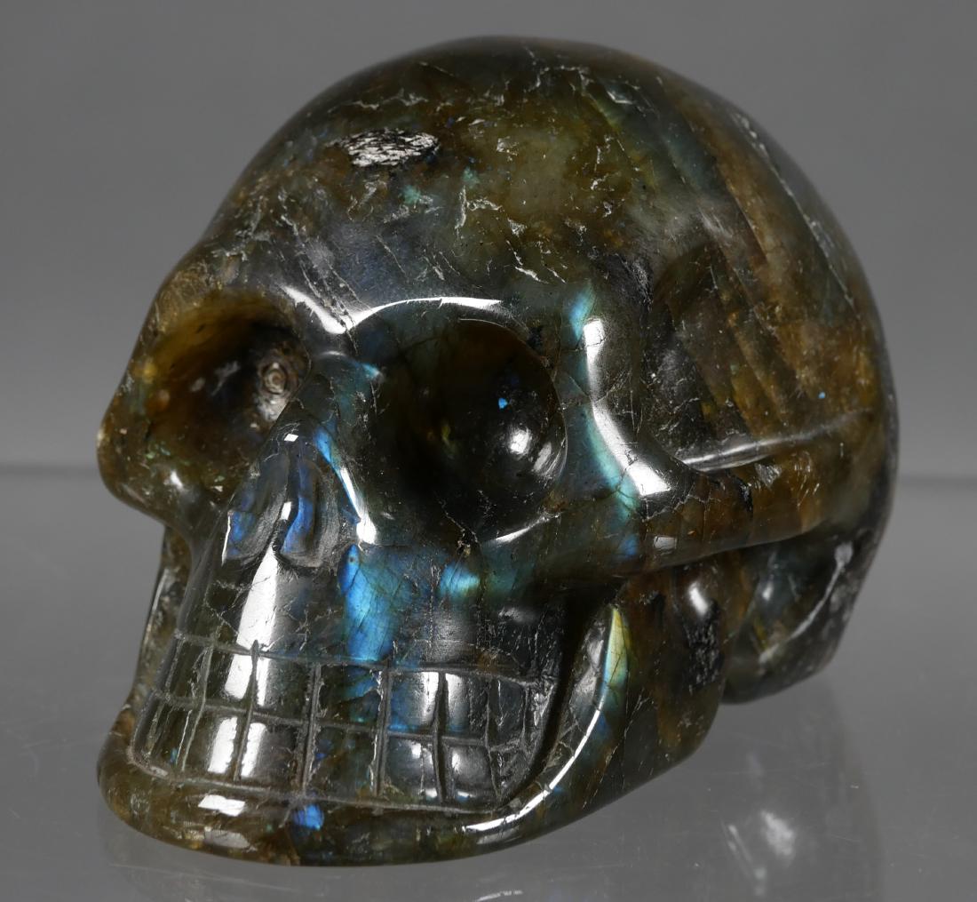 CRYSTAL SKULL 680g Labradorite Carved: Large, 4" long skull carved and polished from what is believed to be labradorite. The appearance from the side is similar to variegated spinach jade, but when viewed full in the face, the light reflec