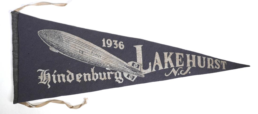 1936 HINDENBURG Lakehurst NJ Pennant: Original felt pennant from Lakehurst, NJ, depicting the German Zeppelin Hindenburg. Dated 1936. Measures 27-1/2" long. The airship flew from 1936 until May 1937, when it crashed in Lakehurst, killing 