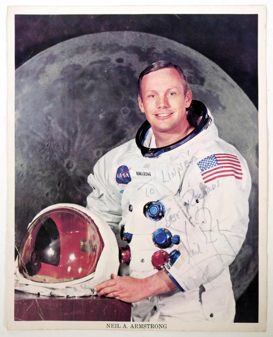 NEIL ARMSTRONG Astronaut Signed Photo 8x10: Color NASA publicity portrait of astronaut Neil Armstrong, signed in marker, "To Linne's, Best Regards, Neil Armstrong" on lower right. Unconditionally guaranteed to be authentic.