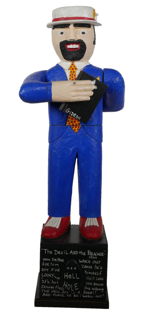 SHANE CAMPBELL, Devil & Preacher Folk Art 26": Folk or outsider art carved wood piece by Campbell, East Tennessee. Circa 2000. Articulated figure on the lid of a platform on which is written "The Devil and the Preacher Man." The figure rotates at 