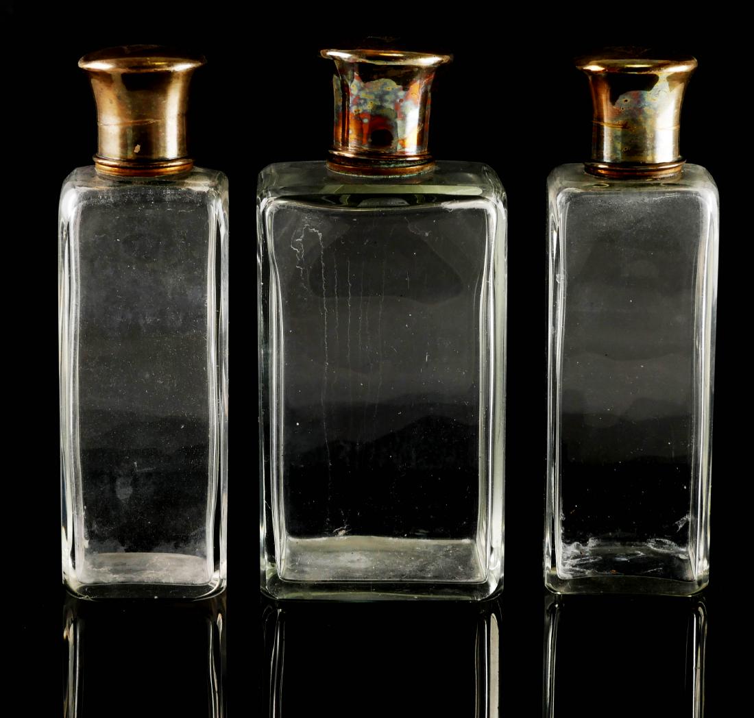 Myrna Loy, Personal Monogram Perfume Bottles: Three finely made perfume bottles, likely French, with silver lids, each one monogrammed with Art Deco styled initials ML. Gifted by Myrna Loy in the 1970s to a personal friend, actress Michaelina Mar