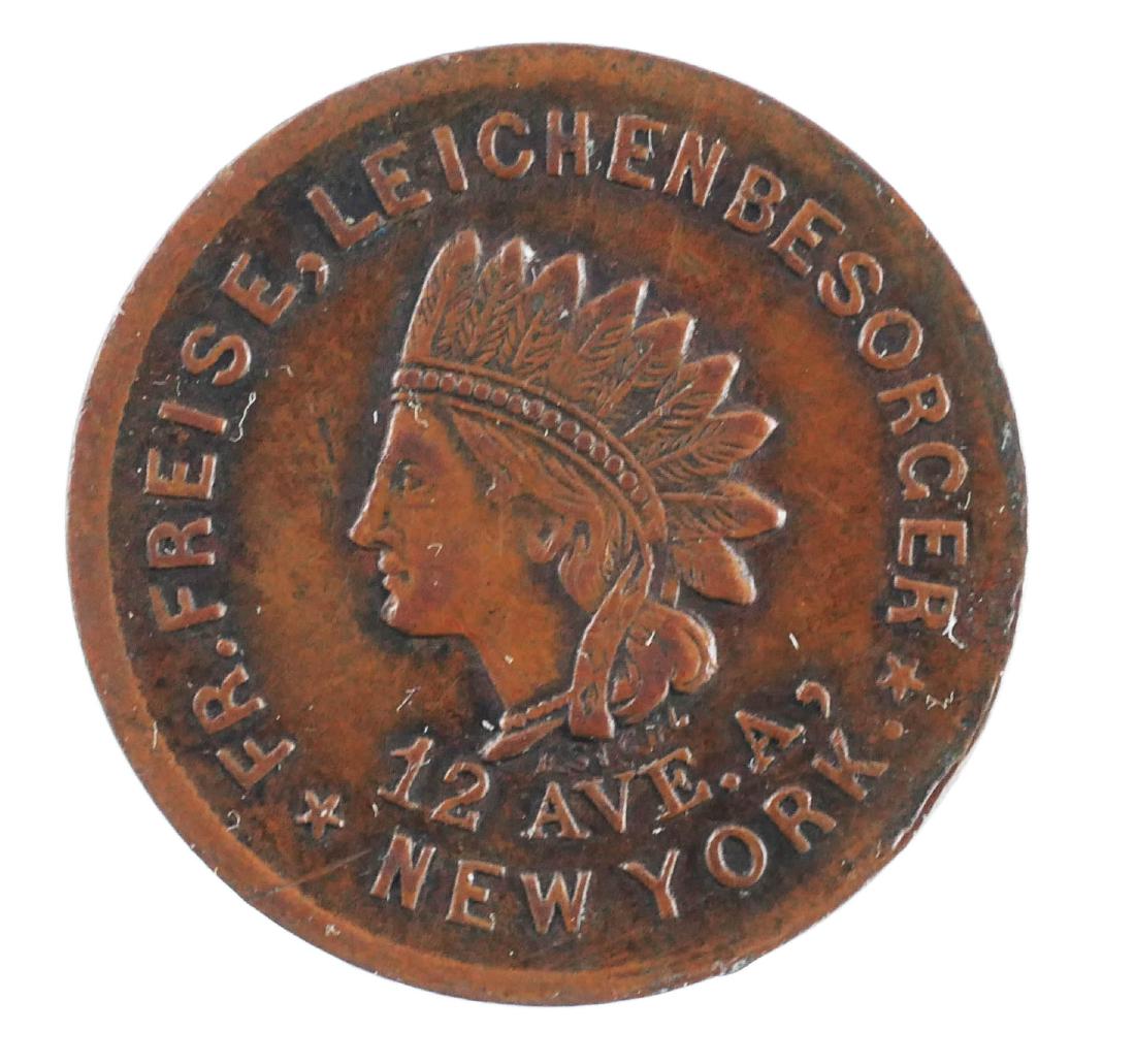 COIN: 1863 TRADE TOKEN New York Undertaker: Nice condition. Fr. Freise Leichenbesorger, 12 Ave A, New York City. Indian head on one side and a coffin on the other.