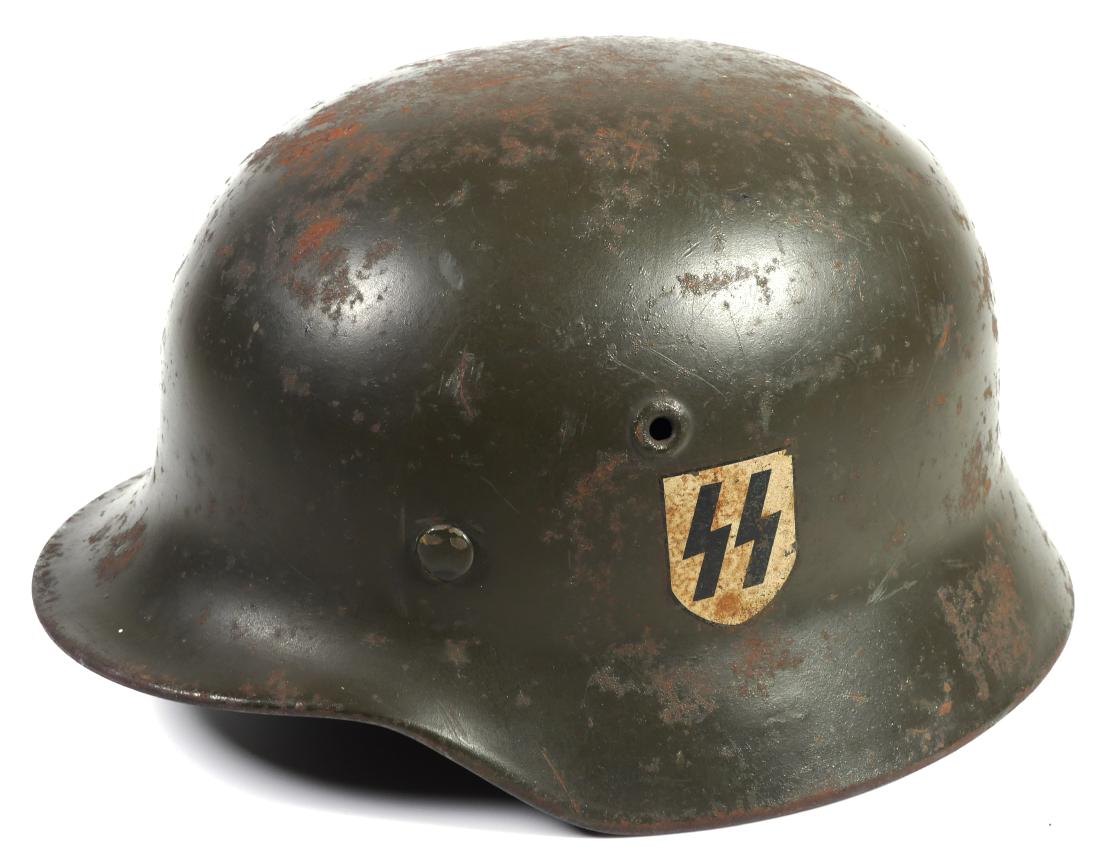 WWII German Nazi Helmet M40: Circa late WW2 German helmet by Quist, size Q64 stamped on inside left. Batch serial number on inside back is T742. Liner is stamped 57. All good so far. But the decal -- according to sources who know