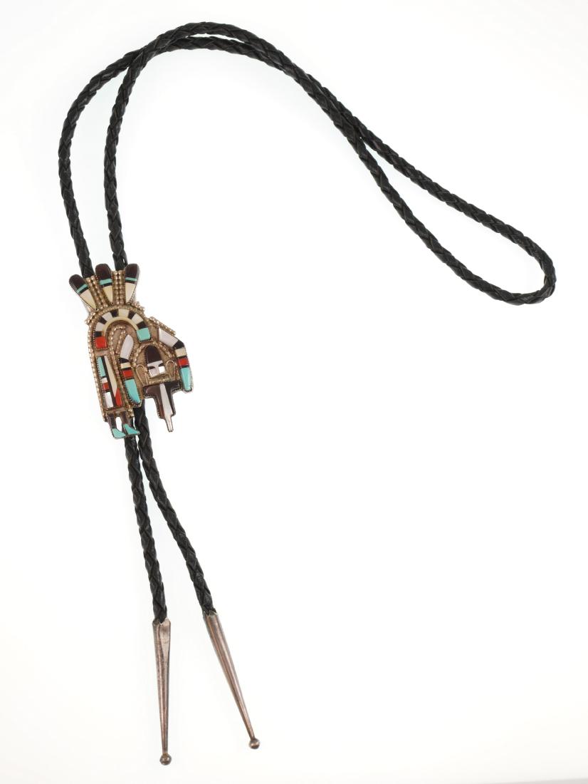 Zuni HERBERT & ESTHER CELLICION Bolo Tie: Zuni sterling silver bolo tie signed "HE CELLICION, ZUNI." Measures about 2-5/8" long.