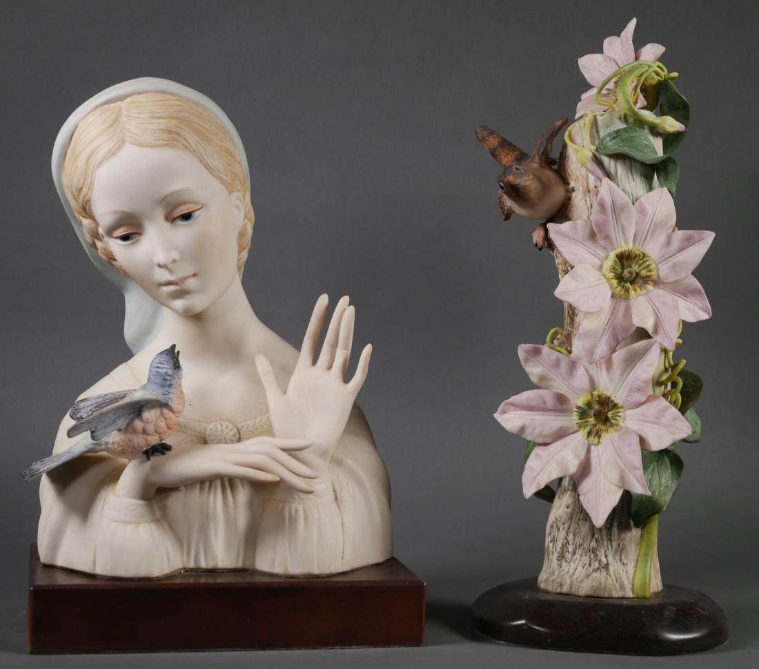 Pair of Cybis Bisque Porcelain Statues: One statue of the Virgin Mary with a bird on her hand. One bird on a branch with vines. Both signed Cybis. Tallest measures 13 1/2".