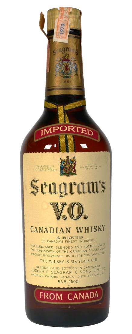 Seagrams VO Whiskey Bottle, Sealed, 1970: A 4/5 quart sealed bottle of Seagrams VO whiskey with original tax labels still intact, one dated 1970. Contests are incidental and not meant for consumption.