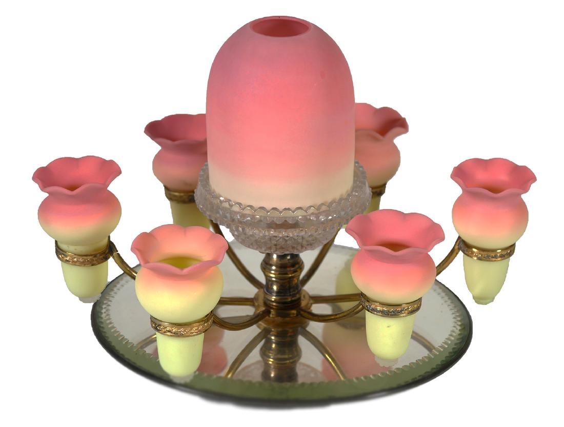 WEBB BURMESE EPERGNE Fairy Lamp: Very hard-to-find Webb Burmese epergne with six vases surrounding the center lamp shade. Mounted on beveled mirror. Mirror measures about 9" long. Fine condition, with no damage.