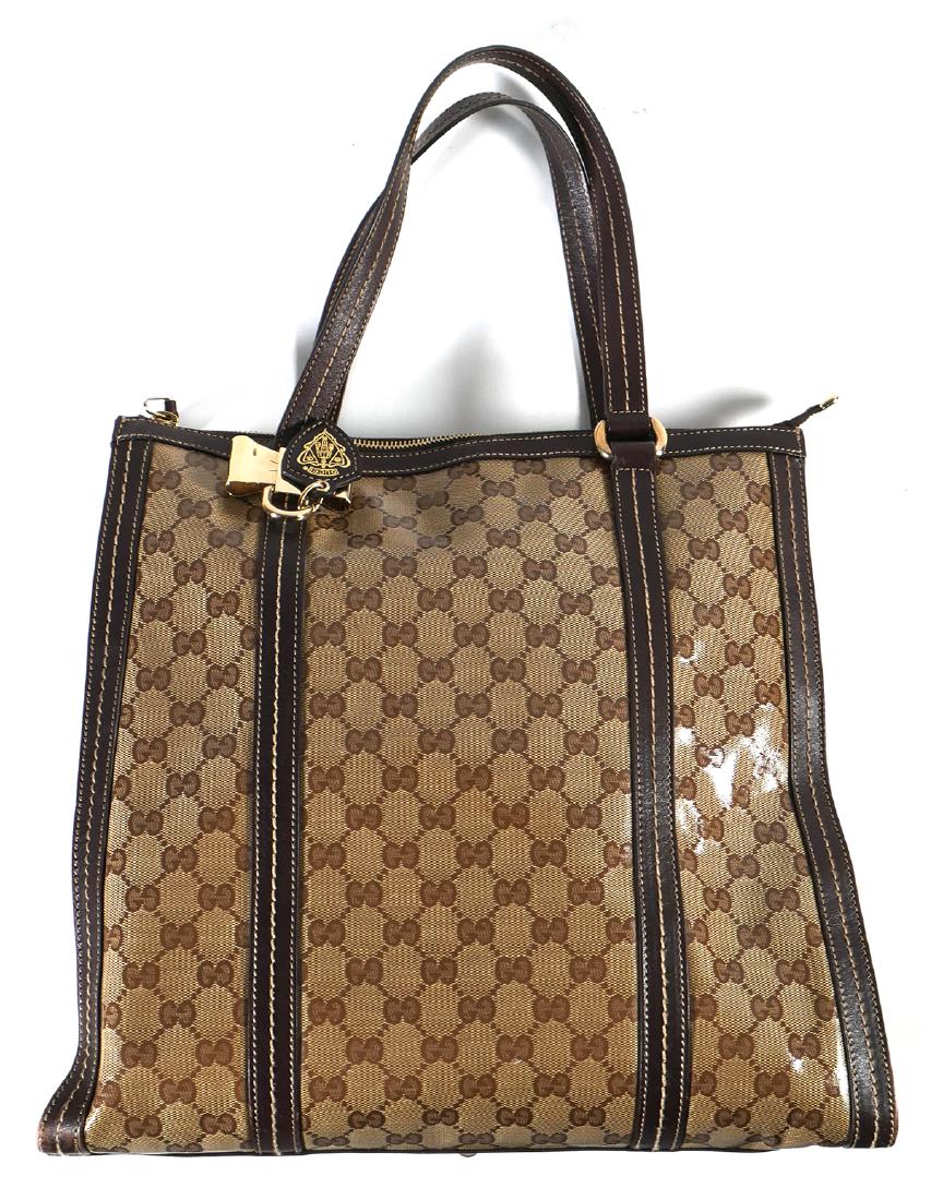 GUCCI Duchessa Tote Bag: Guaranteed authentic Gucci tote handbag, Duchessa model, in very fine condition, with minimal evidence of use. Measures about 14" wide x 12" high (19" high with handles up). Unconditionally guaranteed