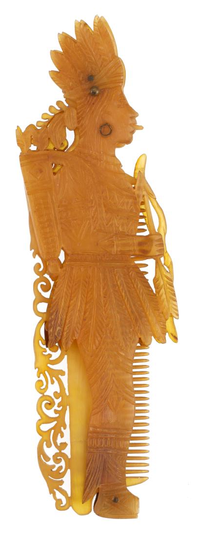 Antique Caribbean Tortoise Shell Comb: 19th Century sailor's carved tortoise shell folding comb in the shape of a Native. Comb measures 6" tall.