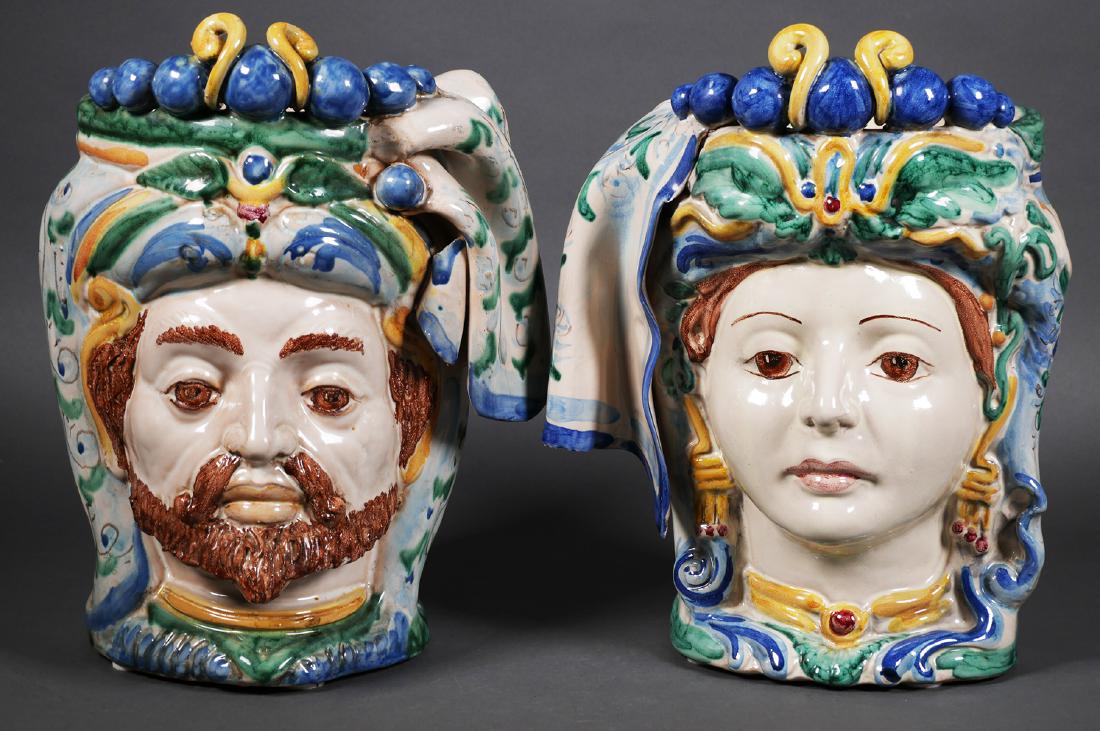 (2) Antique Italian Majolica Head Vases: Matched pair of majolica (maiolica, maioliche) head vases by G. Pistone of Caltagirone, including a wealthy man and woman, possibly king and queen. Each measures 10 1/2" tall. Unsigned.