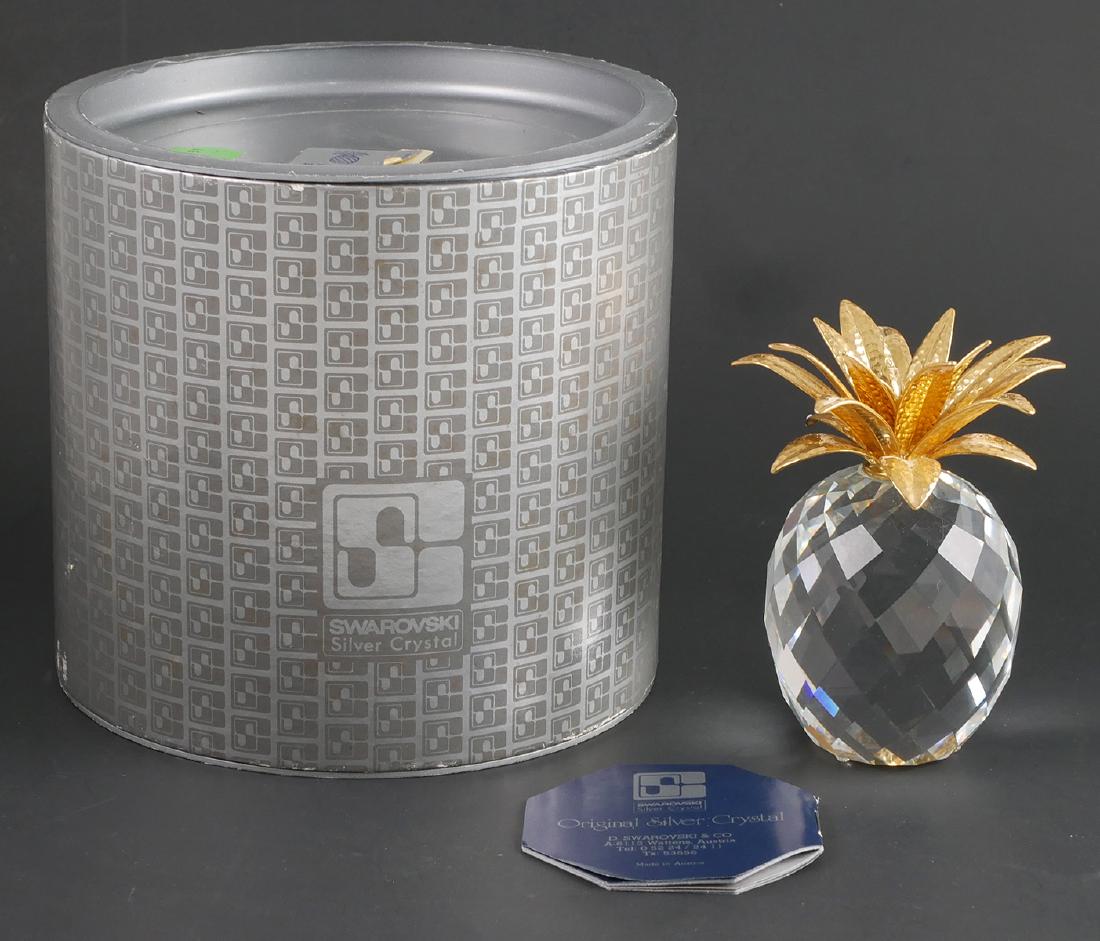 Swarovski Pineapple Figurine: Swarovski Silver Crystal pineapple figure. Marked to underside. Figurine measures 4 1/4" tall. In original box.
