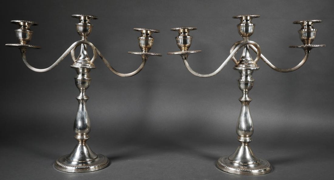 Pair of Sterling Silver Candelabra: Matched pair of weighted sterling candelabra with detachable three-candle top sections. Illegible mark under base. Each measures 13 1/2" tall.