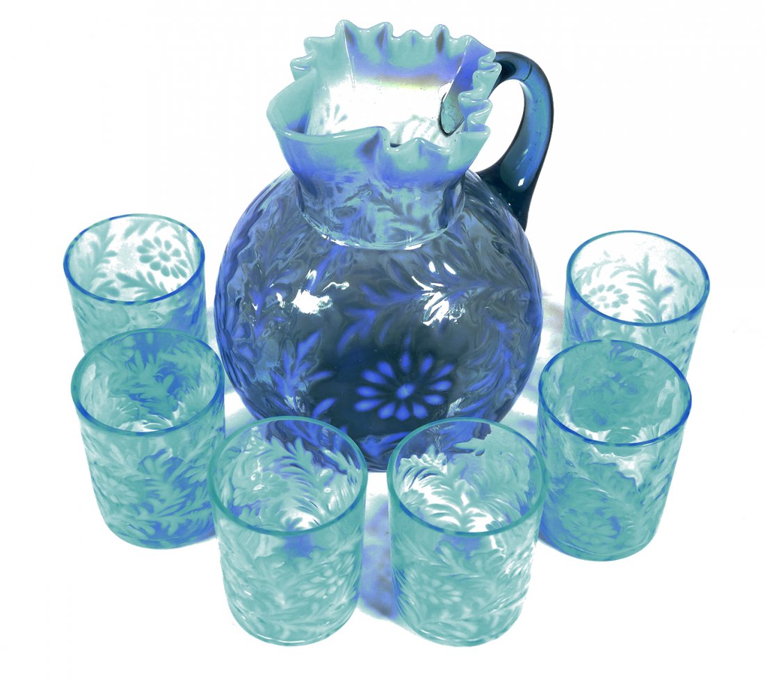 Blue Opalescent Water Pitcher & Six Tumblers: Northwood Daisy & Fern pitcher and cups. Pitcher is 8-3/4" high. All pieces are in fine, undamaged condition. No chips or cracks.