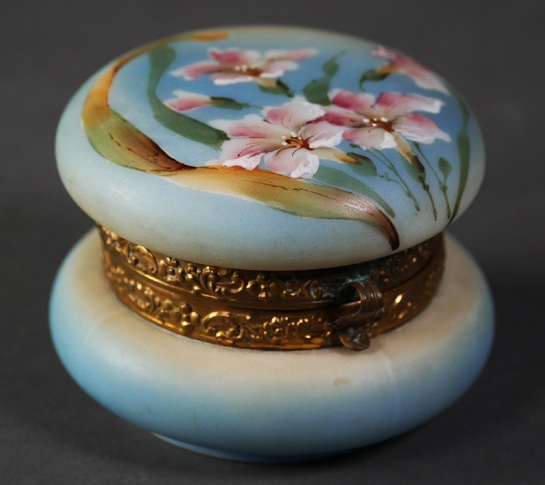 NAKARA C. F. Monroe Dresser Trinket Box: Nakara glass box. Measures 2-3/4" high and 3-3/4" diameter. Signed on bottom. Frayed lining on inside. Fine condition, with no damage to glass or metal.