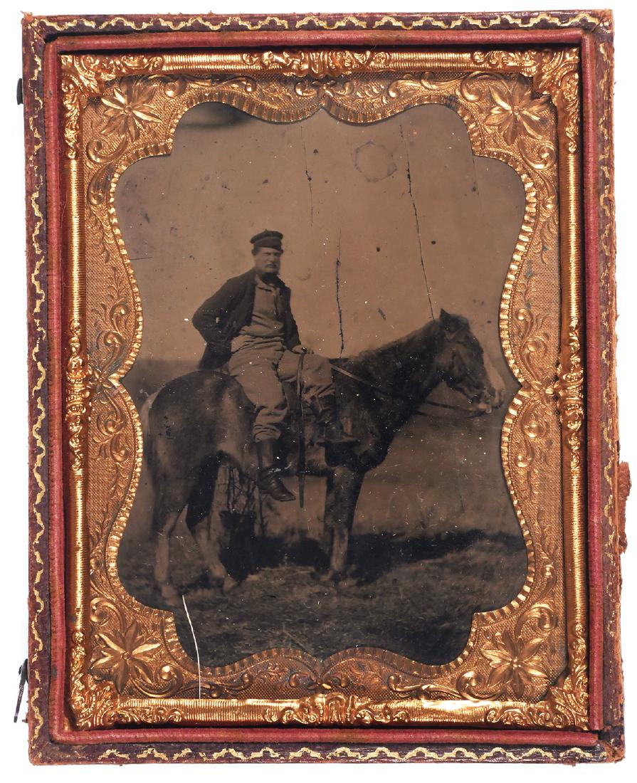1/4 Plate Tintype, Soldier Outdoor on Horseback: 1/4 Plate tintype photograph of a man on a horse, likely a soldier as he is wearing cavalry boots. Half case. Measures 4 3/4" tall. Good condition. Some flexes to plate.