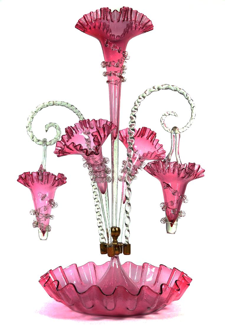 Victorian 22" Cranberry Art Glass Epergne: Pink glass epergne with three lillies, two hanging baskets. Overall height when assembled is 22". Excellent condition with no chips, cracks or damage.