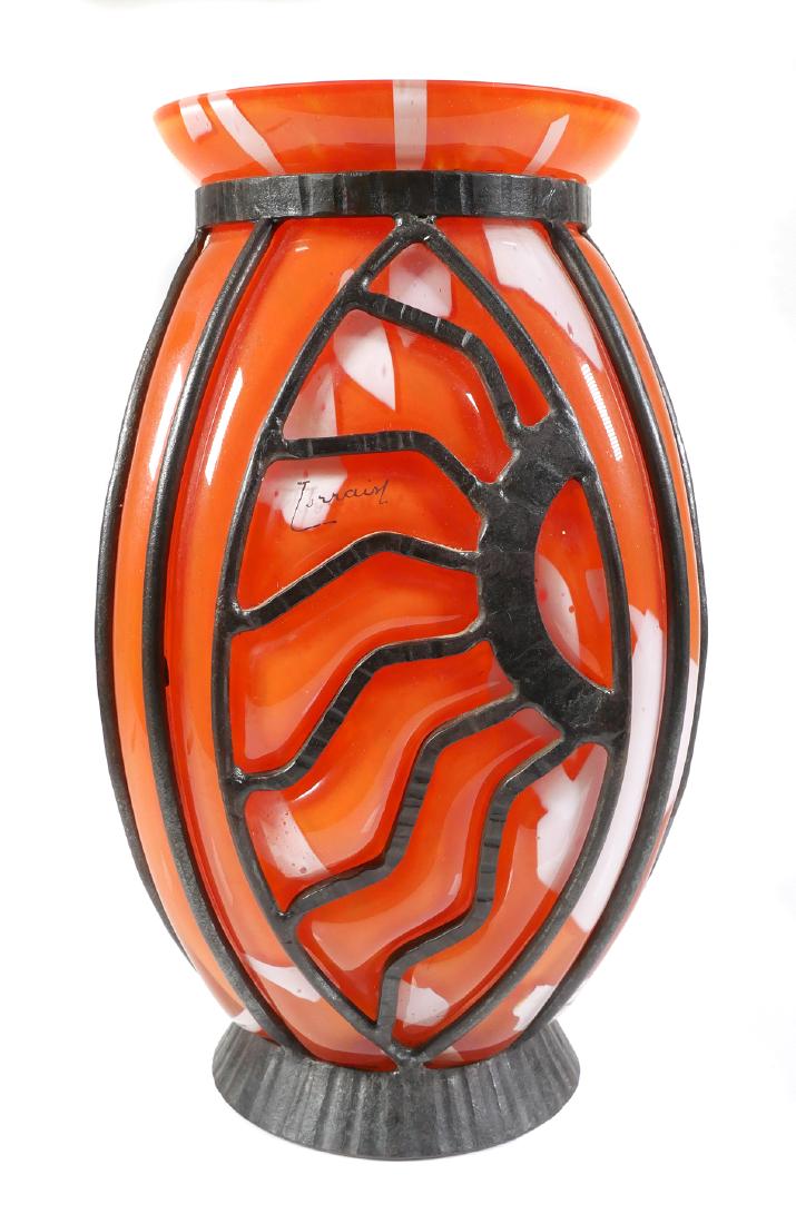 Daum Art Glass Wrought Iron Lorrain Vase: Striking Art Deco glass vase attributed to Daum's Verrerie d'Art Lorrain, blown in a wrought iron armature. Measures just under 12" high. Signed "Lorrain" on side. No damage -- fine condition.