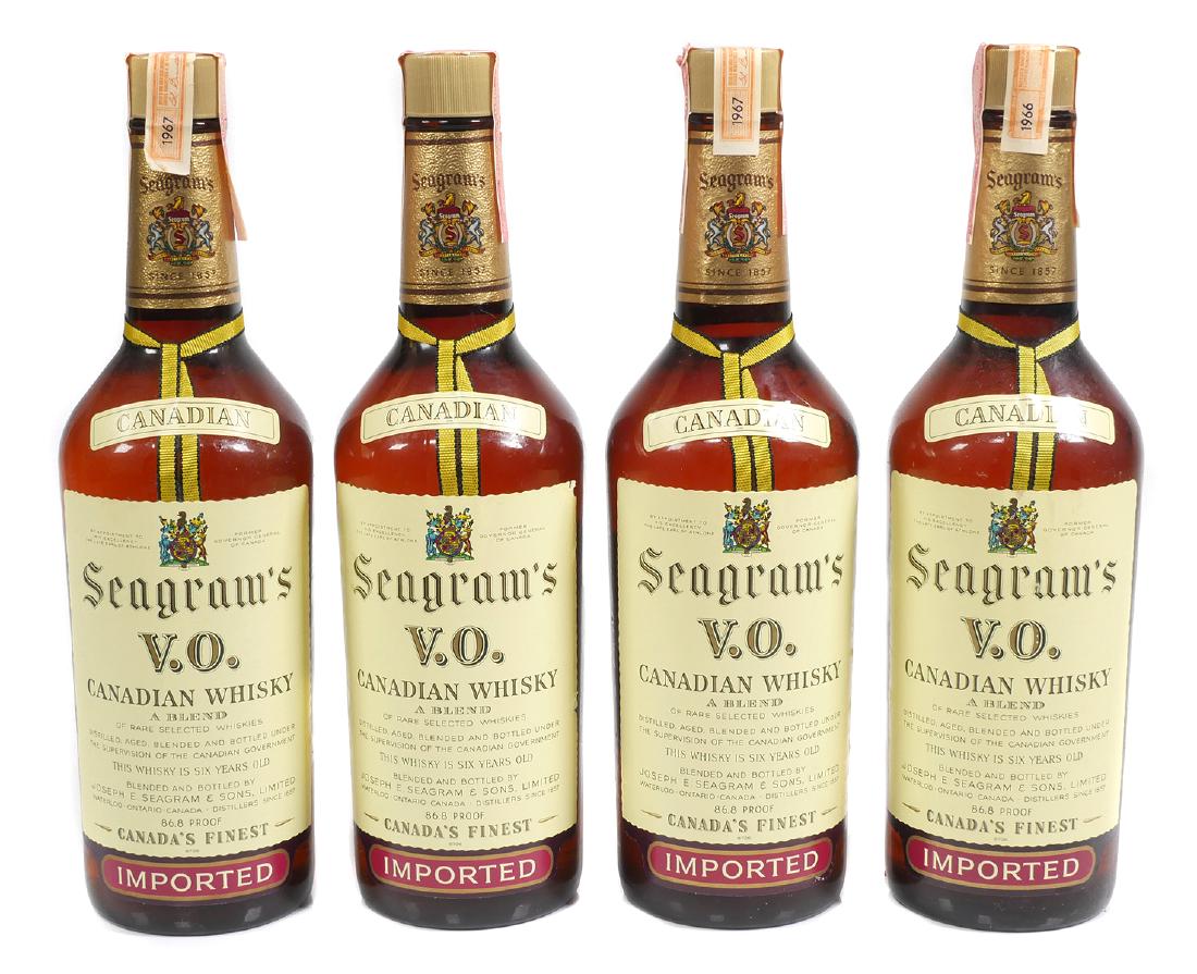 (4) SEAGRAM'S VO Sealed Whiskey Bottles, 1960s: Four 4/5 quart sealed bottles of Seagrams VO whiskey with original tax labels still intact, all dated to the 1960s. Contents are incidental and not meant for consumption.