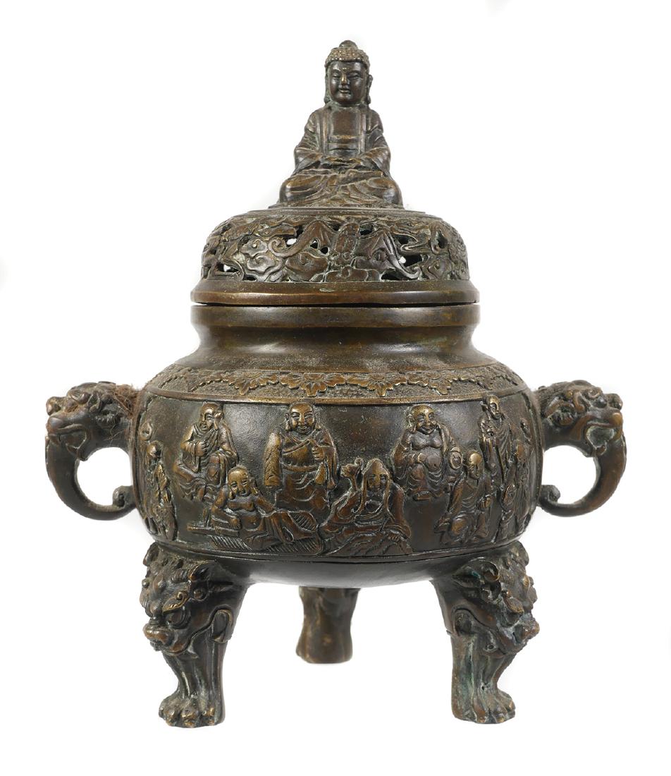 Chinese Bronze Buddhist Censer, Marked: Antique Chinese bronze tripod censer with lohan, dragons, bats and a Buddha finial. Impressed six character Ming Xuande mark under base. Measures 6 3/4" tall with lid. Very good condition with some we