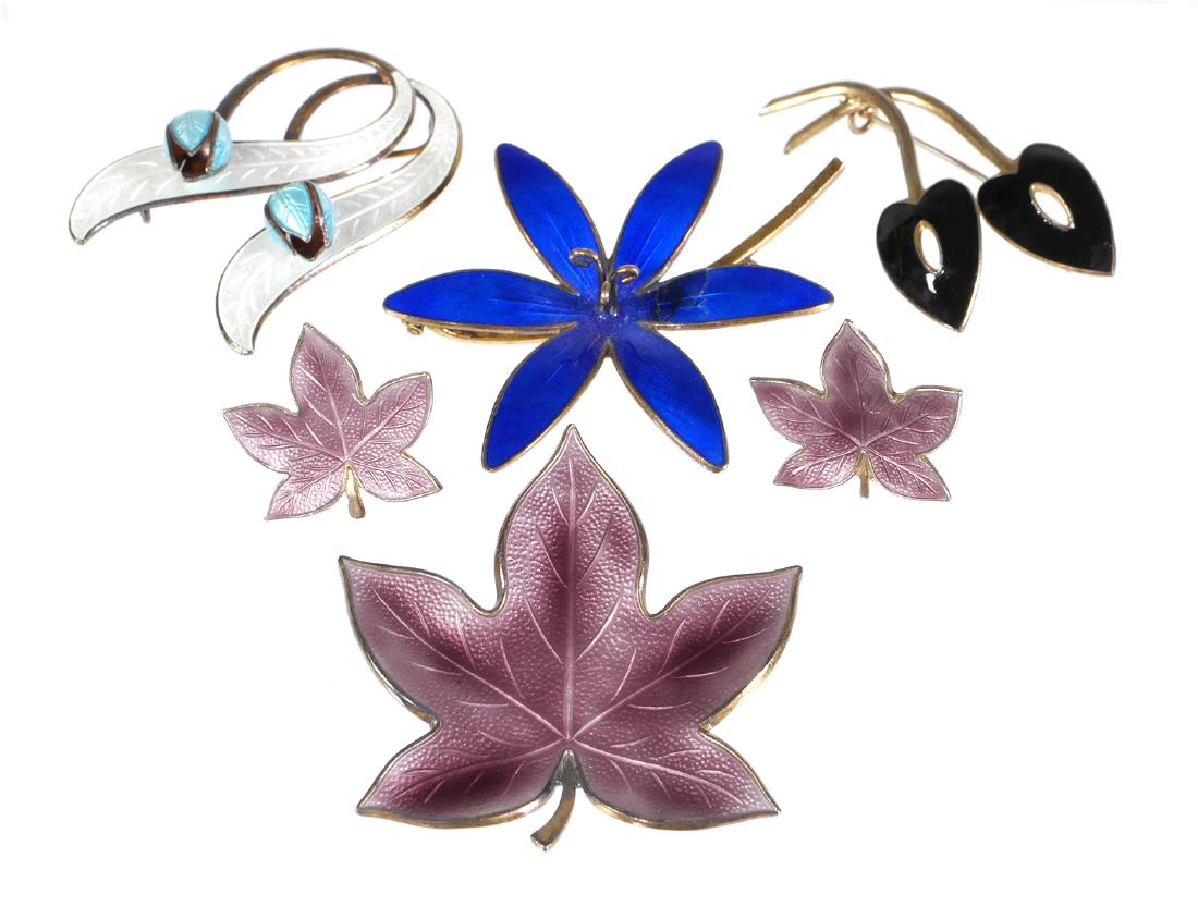 Scandinavian Sterling Enamel Jewelry Lot: Pins and earrings from Denmark and Norway designers, all sterling silver with guilloche enameling. Blue flower pin has some hairlines in the enamel on one petal, and there is a little enamel wear on o