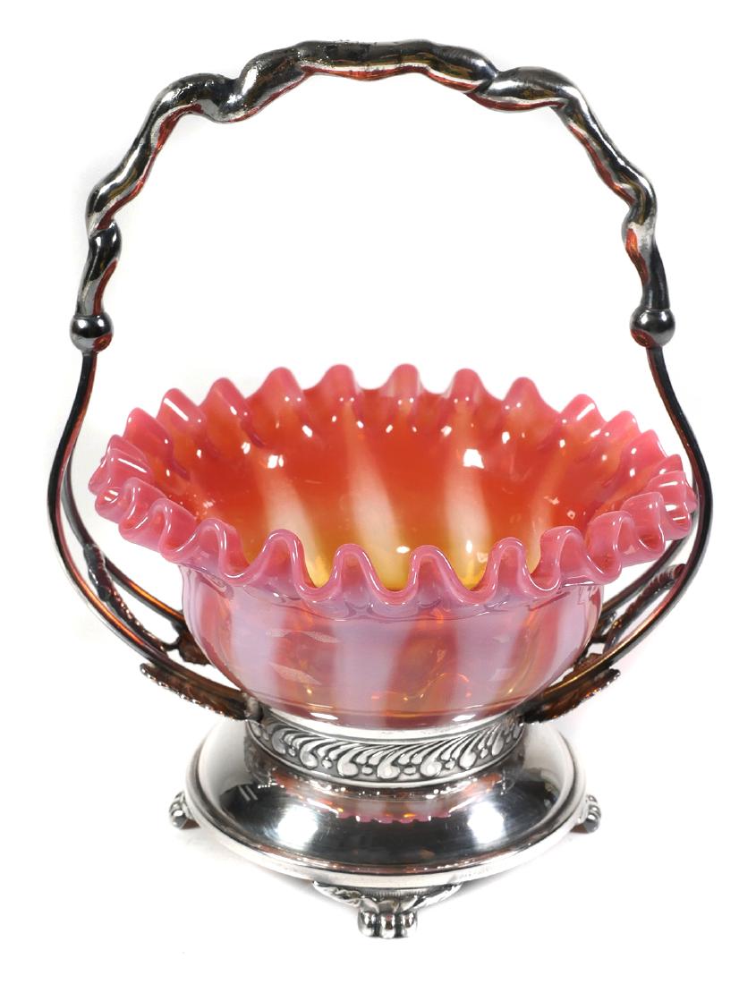 Pairpoint Opalescent Art Glass Miniature Basket: Victorian art glass ruffled basket with opalescent vanes. Signed Pairpoint silverplated frame. Bowl measures 5-1/2" diameter. Frame is 8" high. Handle appears to have a solder repair.