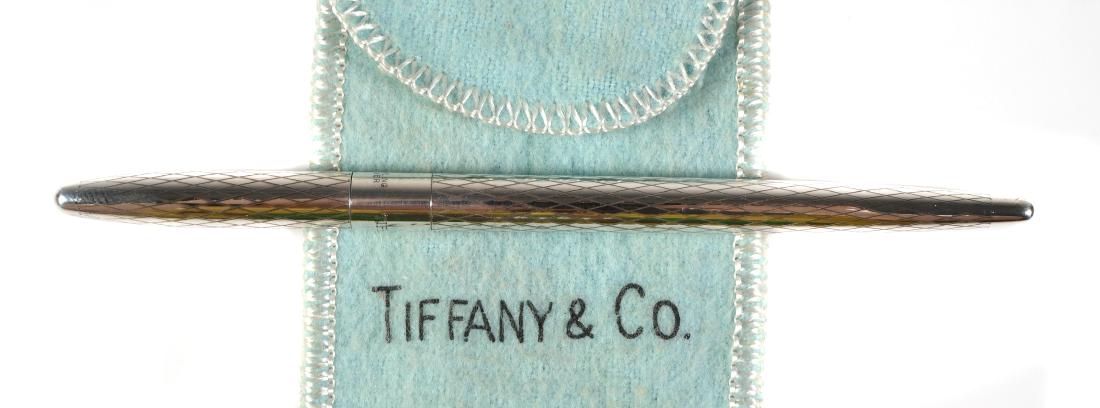 Vintage TIFFANY & Co Sterling Silver Pen & Pouch: Vintage Tiffany & Co sterling silver pen & cloth pouch. Barrel is marked TIFFANY & CO. Sterling Silver. Pen measures approx. 4 7/16" capped. No damage, light wear marks on the barrel & cap. Pen needs