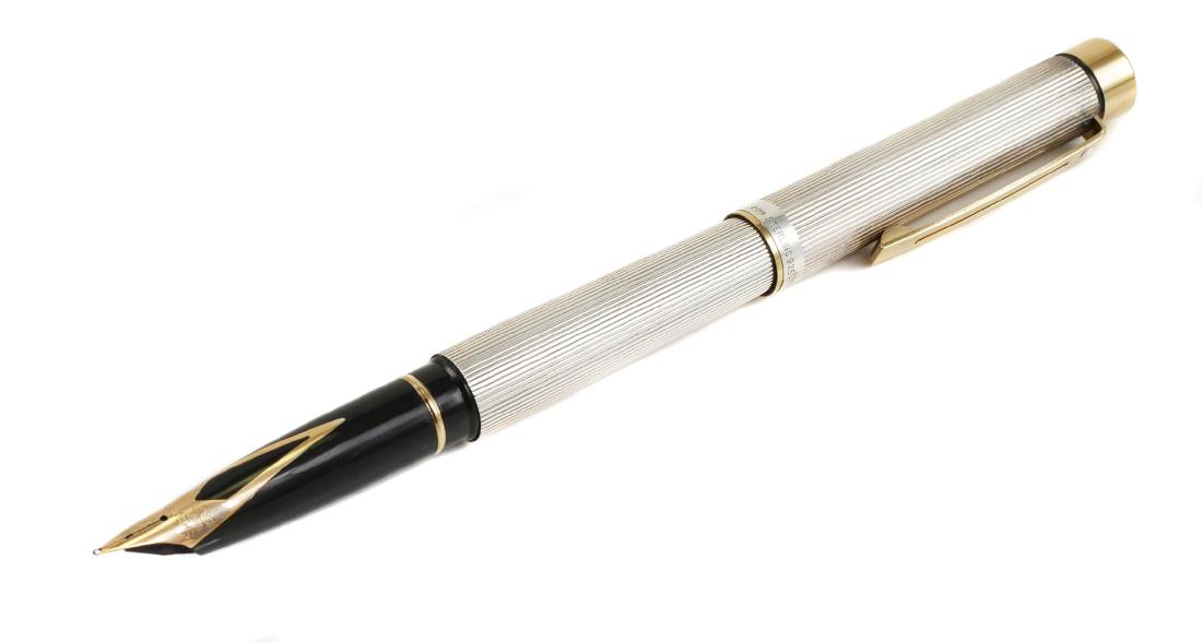 SHEAFFER Sterling Targa 14K Nib Fountain Pen: SHEAFFER sterling silver Targa with 14K gold nib fountain pen. Nib is marked Sheaffer, USA, 585 14K. Cap & barrel are both marked 925. Pen is approx. 5 5/16" capped. Box, user guide, converter (inside