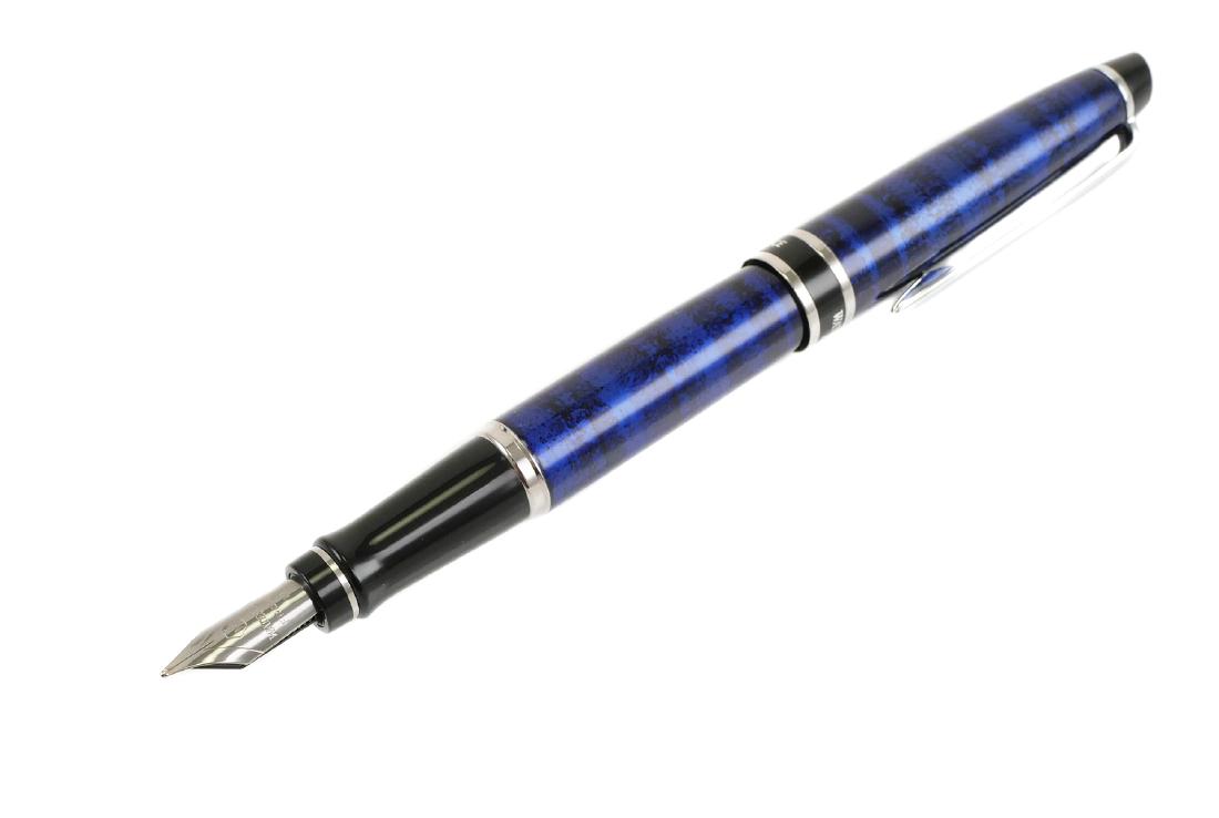 WATERMAN Expert Dune Blue Medium Nib Fountain Pen: WATERMAN Expert Dune Blue medium nib fountain pen. Nib is marked with logo, Waterman France M. Pen measures approx. 5 1/2" capped. Box and Waterman booklet included. No damage, excellent used conditio
